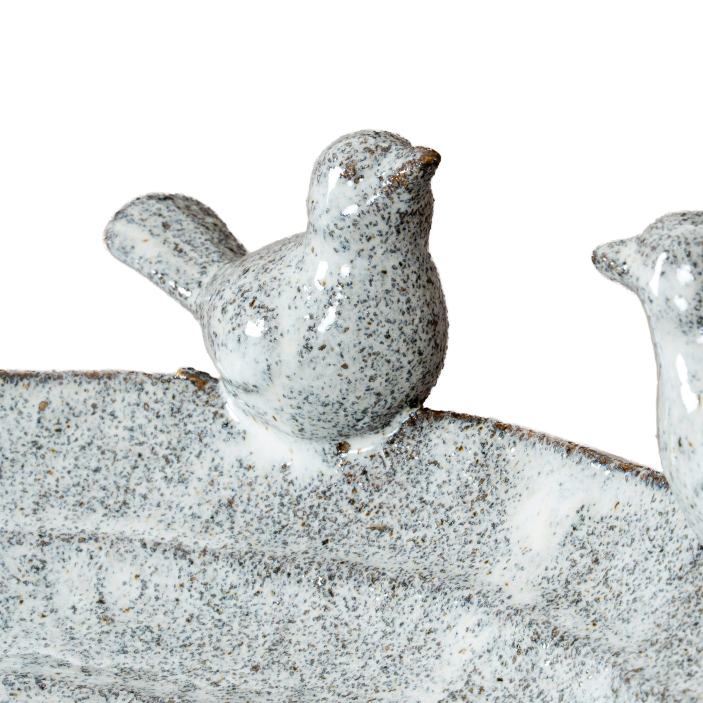 Decorative stone birds on a white background