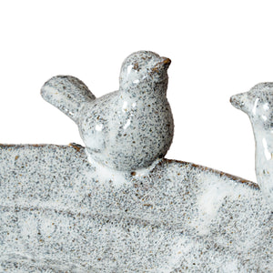 Decorative stone birds on a white background