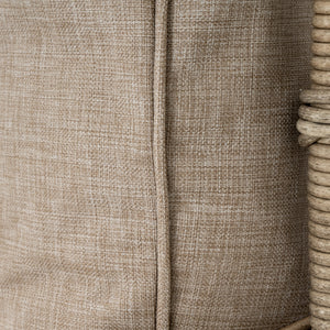 Close-up of a textured beige fabric with a woven pattern