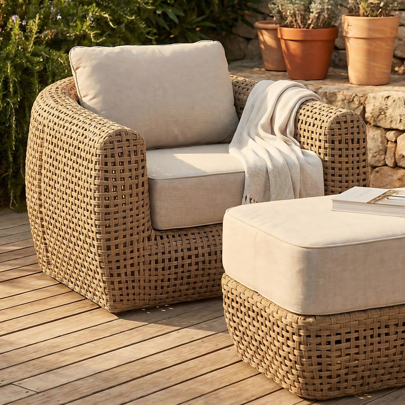 Wicker outdoor furniture set with beige cushions on a wooden deck.