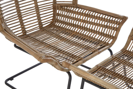 Close-up of a wicker chair with metal legs on a white background