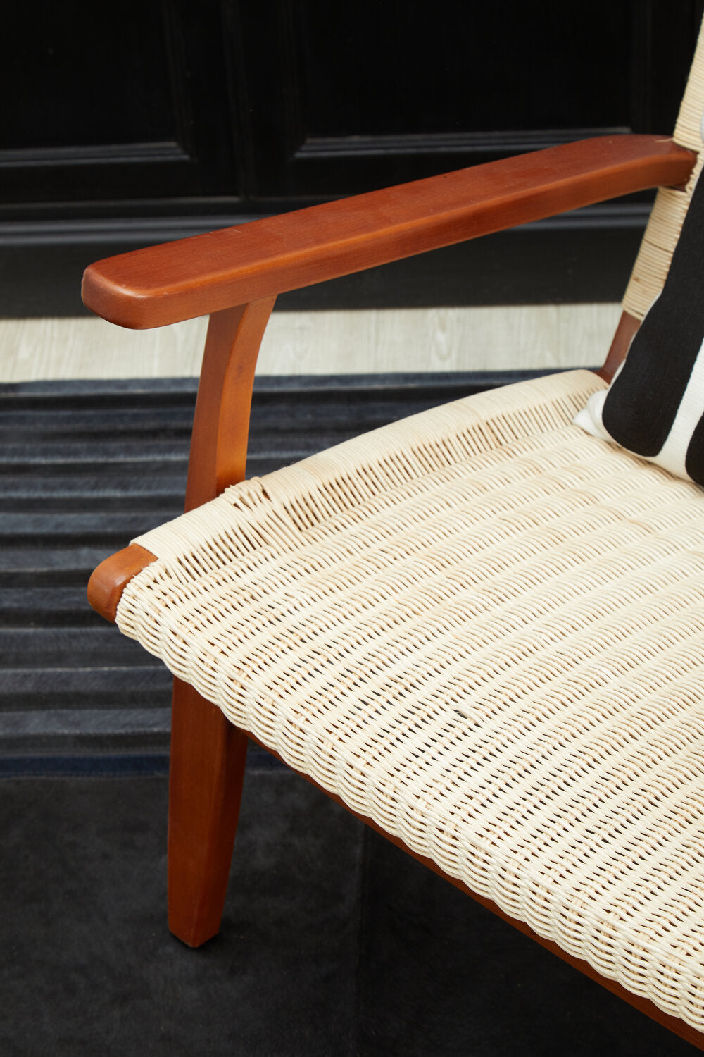Wooden chair with woven seat in a room setting