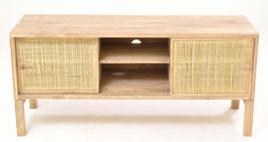 Wooden TV stand with rattan doors on a white background
