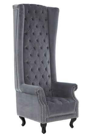 Gray tufted wingback chair with nailhead trim on a white background