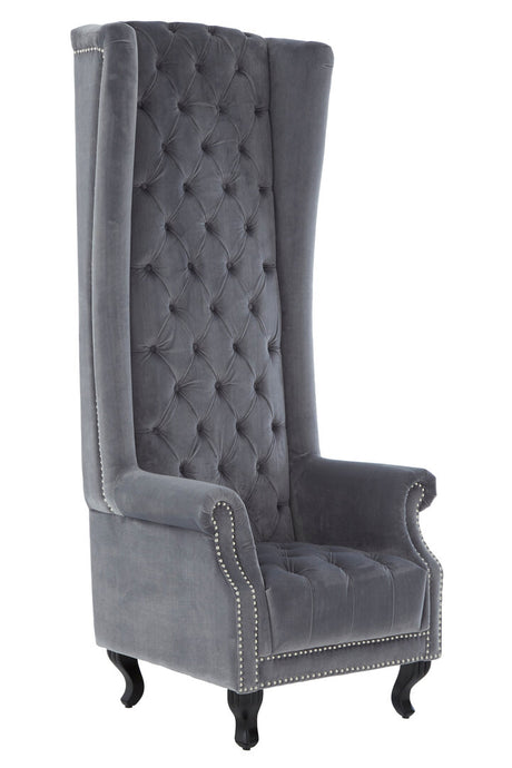 Gray tufted wingback chair with nailhead trim on a white background