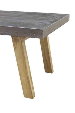 Table with concrete top and wooden legs on a white background