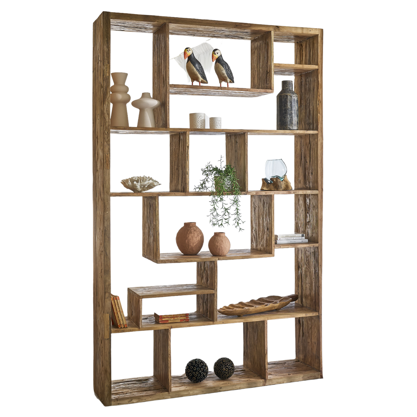 Wooden bookshelf with decorative items on a white background