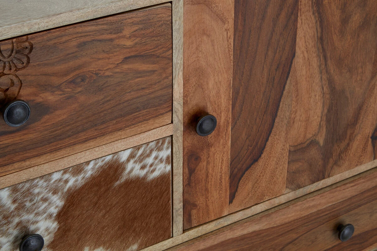 Close-up of the cowhide drawer and rich wood grain on the Folklore sideboard