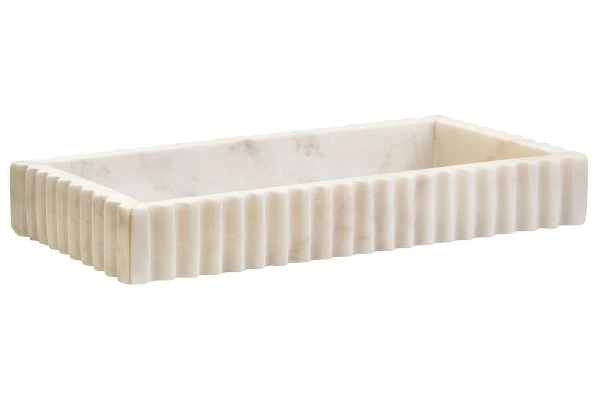 The Vela White Marble Fluted Rectangular Tray from an angle, showing the shallow base and fluted sides.