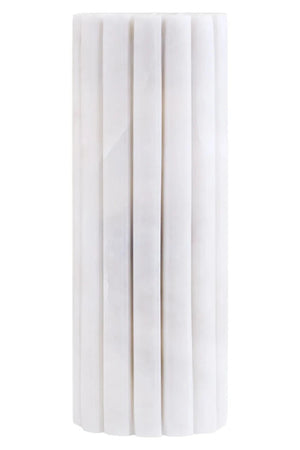 Vela White Marble Fluted Bud Vase, showing the natural veining of the marble.