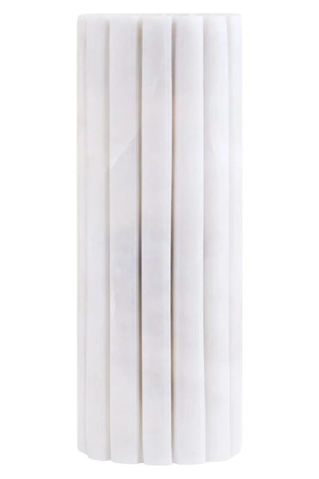 Vela White Marble Fluted Bud Vase, showing the natural veining of the marble.