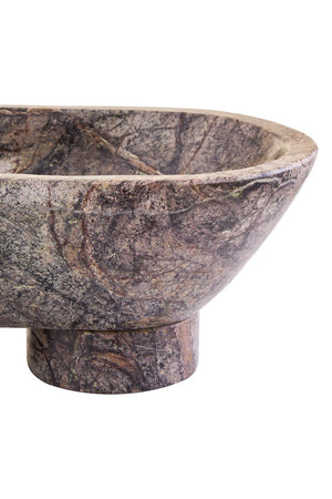 Close view of the end of the Cairn marble bowl, showing the curve of the bowl and polished foot.