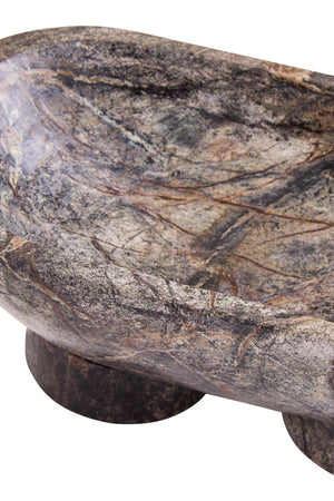 Close-up of the Cairn marble pedestal bowl, showing the plum, rust and green tones of the natural stone.