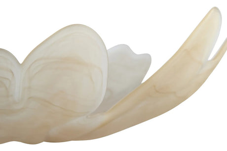 A close-up of a translucent, organically shaped dish with layered, petal-like curves in a warm cream to pale beige tone, isolated on a white background.