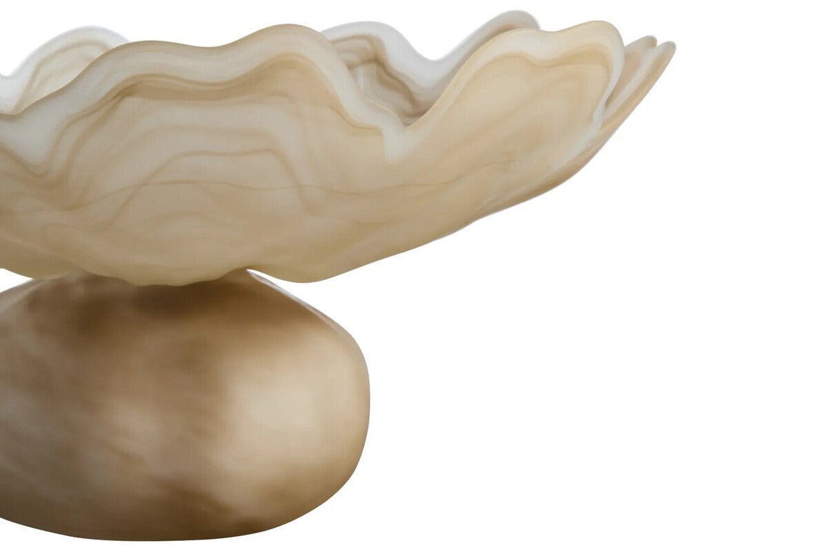 A sculptural bowl with a wavy, layered rim and a smooth rounded pedestal base, shown in warm cream, beige, and tan tones against a plain white background.