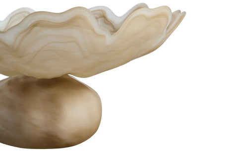 A sculptural bowl with a wavy, layered rim and a smooth rounded pedestal base, shown in warm cream, beige, and tan tones against a plain white background.