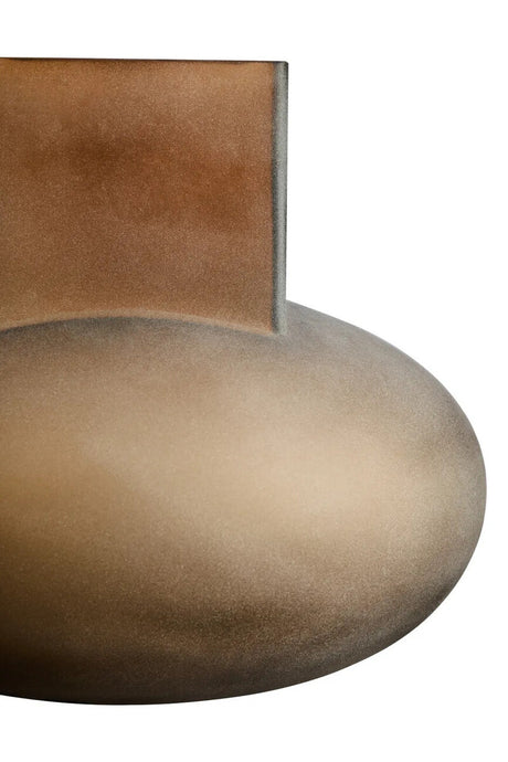 Close-up of a brown vase with a white background