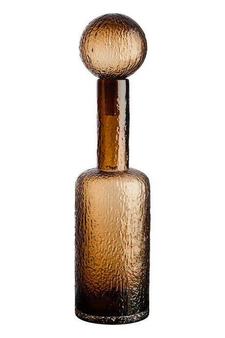 Brown glass bottle with textured neck on a white background