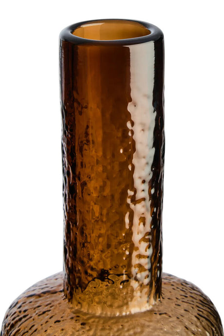 Brown glass vase with textured surface on a white background