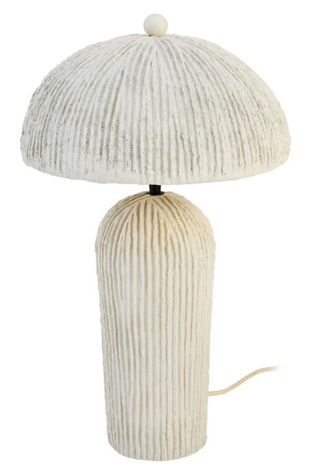 Beige textured table lamp on a white background