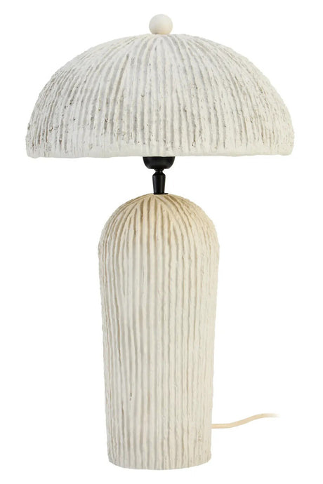 Table lamp with ribbed design on a white background