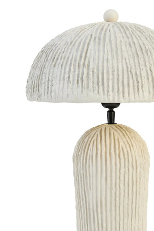 Decorative table lamp with ribbed design on a white background
