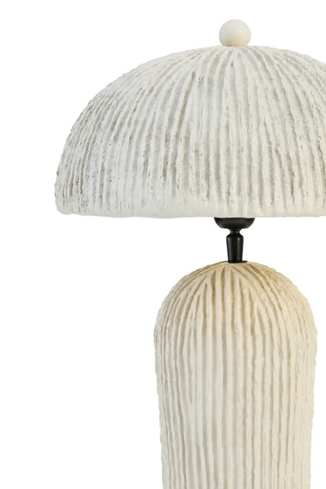 Decorative table lamp with ribbed design on a white background
