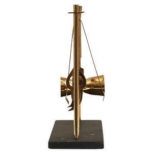 Side view of the Loxley black slate and gold bar tool stand