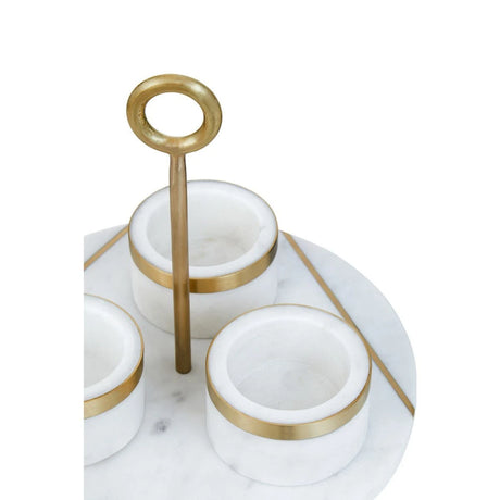 Close-up of the white marble bowls and gold inlay on the Loxley condiment tray