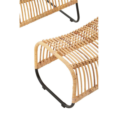 Close-up of a wicker chair with black metal legs on a white background
