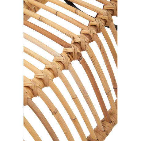 Close-up of a woven rattan chair with a white background