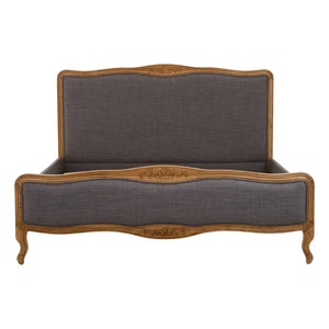 Front view of the Vienne Grey Fabric Super King Size Bed, showing the shaped carved oak frame around the grey upholstered headboard and footboard.