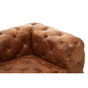 Close up of corner of Durango brown leather chesterfield sofa right arm