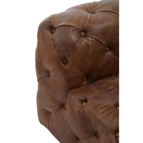 Close up of Durango brown leather chesterfield armchair on a white background