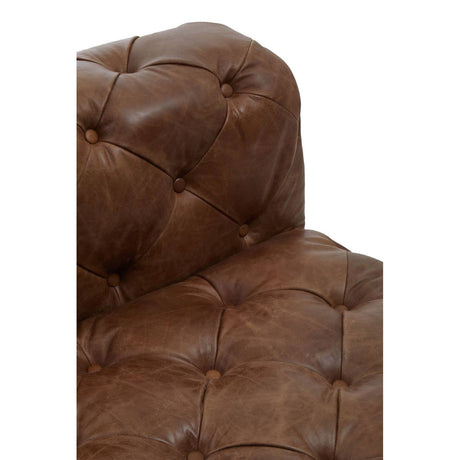 Brown leather armchair with tufted backrest on a white background