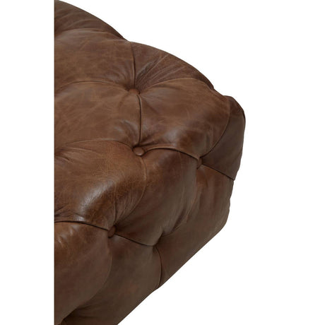 Close up of seat of Durango brown leather chesterfield armchair on a white background
