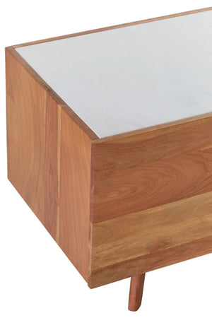 Close-up of the white marble top and acacia wood grain on the Alder media unit