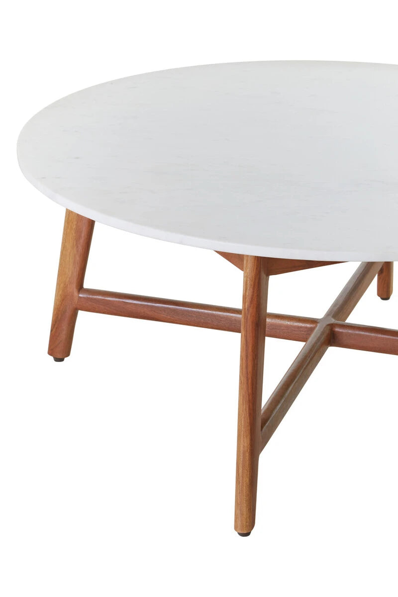 Close-up of the Alder coffee table's acacia wood legs and cross stretcher