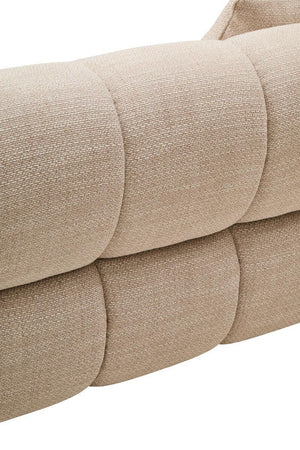 Close-up of a beige textured sofa with a white background
