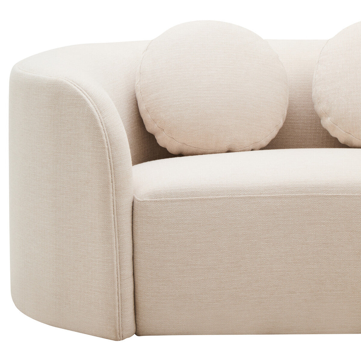 Cream linen curved sofa with round cushions on a white background