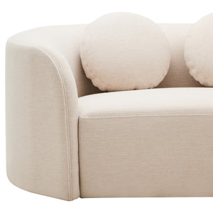 Cream linen curved sofa with round cushions on a white background
