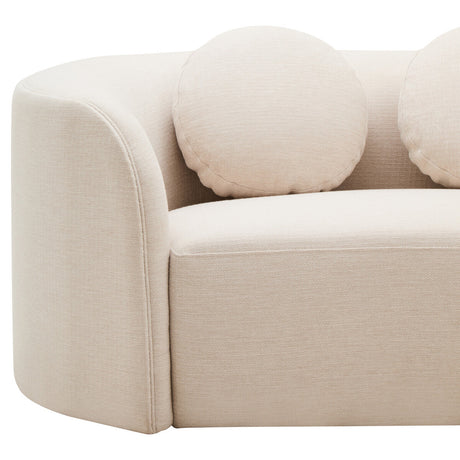 Cream linen curved sofa with round cushions on a white background