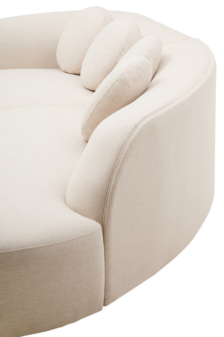 Cream sofa with curved design on a white background