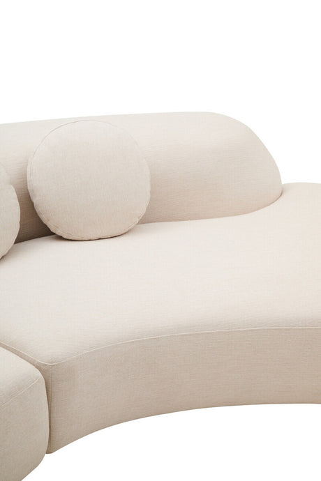 Cream linen curved sofa with round cushions on a white background