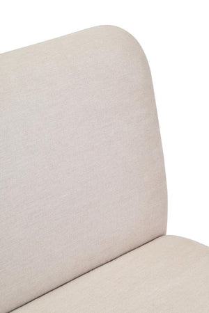 Cream upholstered sofa on a white background