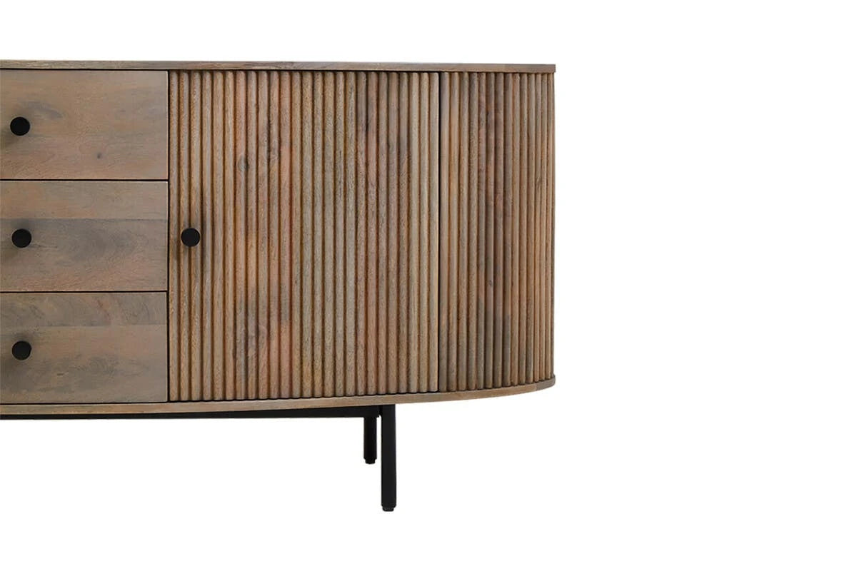 Close view of one end of the Hawthorn Grey Oval Sideboard, showing a reeded door beside the drawers.