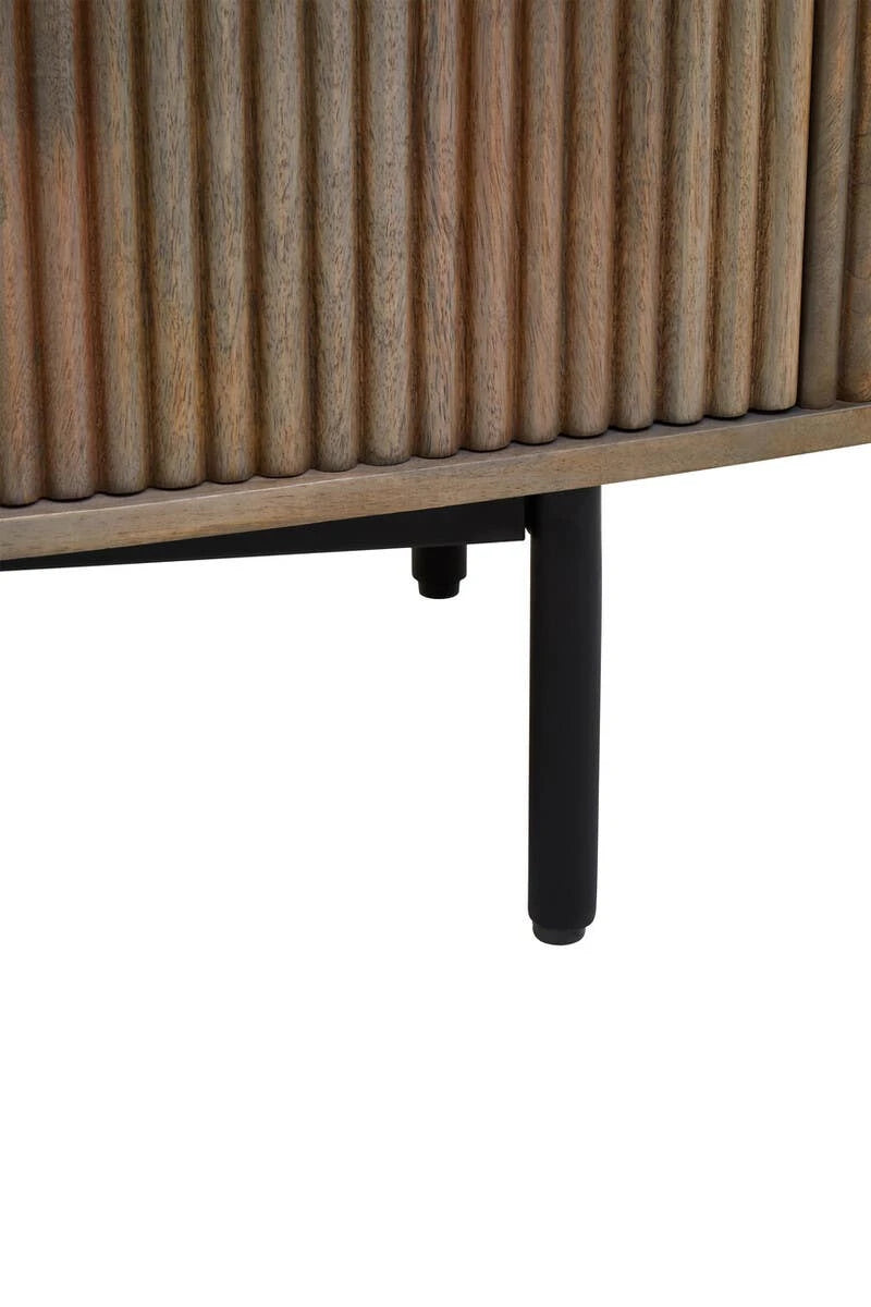 Close-up of the reeded mango wood front and black metal leg of the Hawthorn Grey Oval Sideboard.