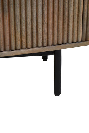 Close-up of the reeded mango wood front and black metal leg of the Hawthorn Grey Oval Sideboard.