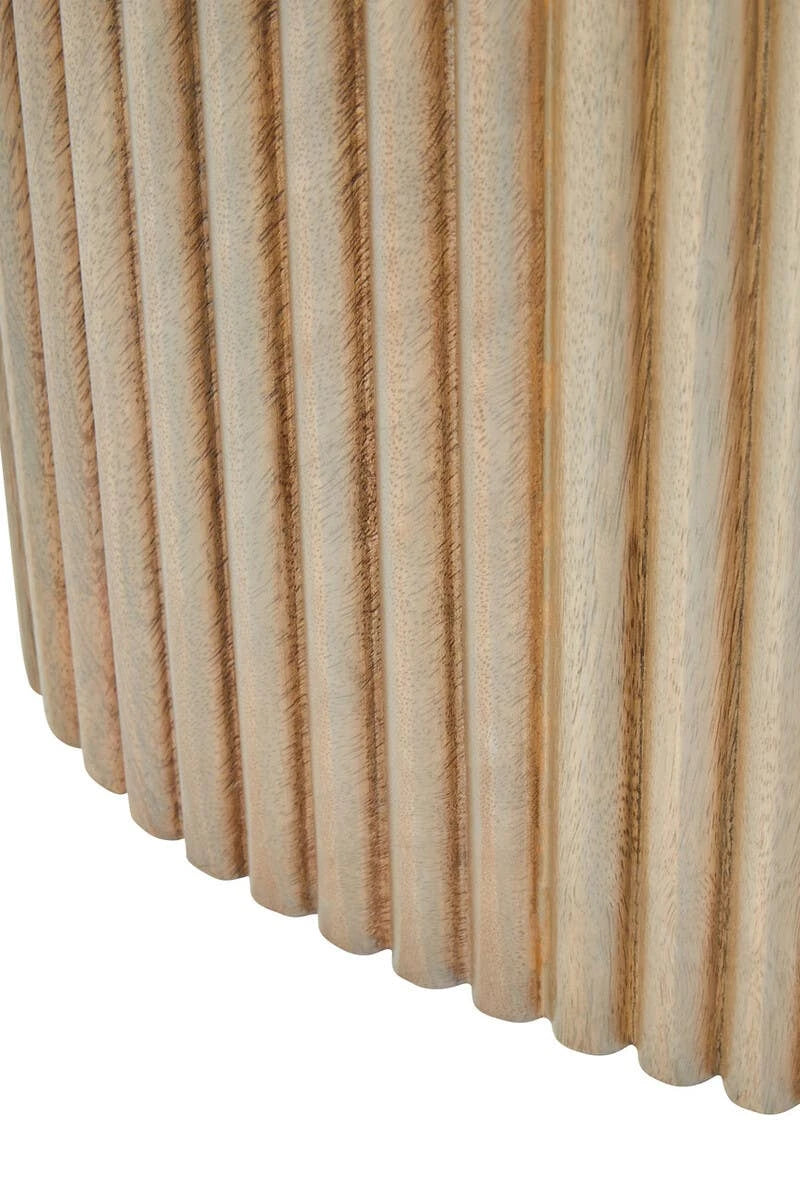 Close-up of the foot of the reeded pedestal base on the Hawthorn Grey Oval Dining Table.