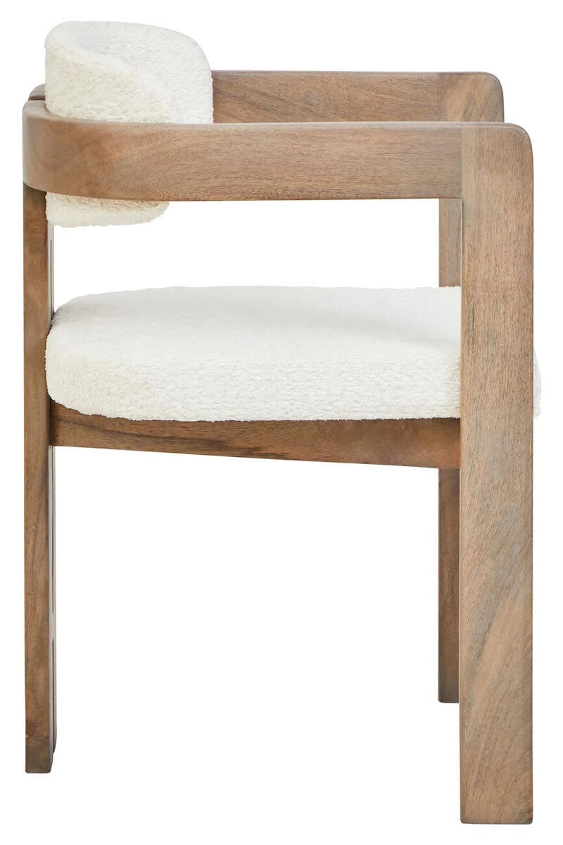 Side view of the Hawthorn Grey Dining Chair, showing the flat mango wood armrest and padded cream bouclé seat.